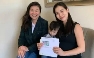 Immigration attorney meeting with a client and family to prepare for a USCIS immigration interview at the Law Office of Carrie Nguyen.